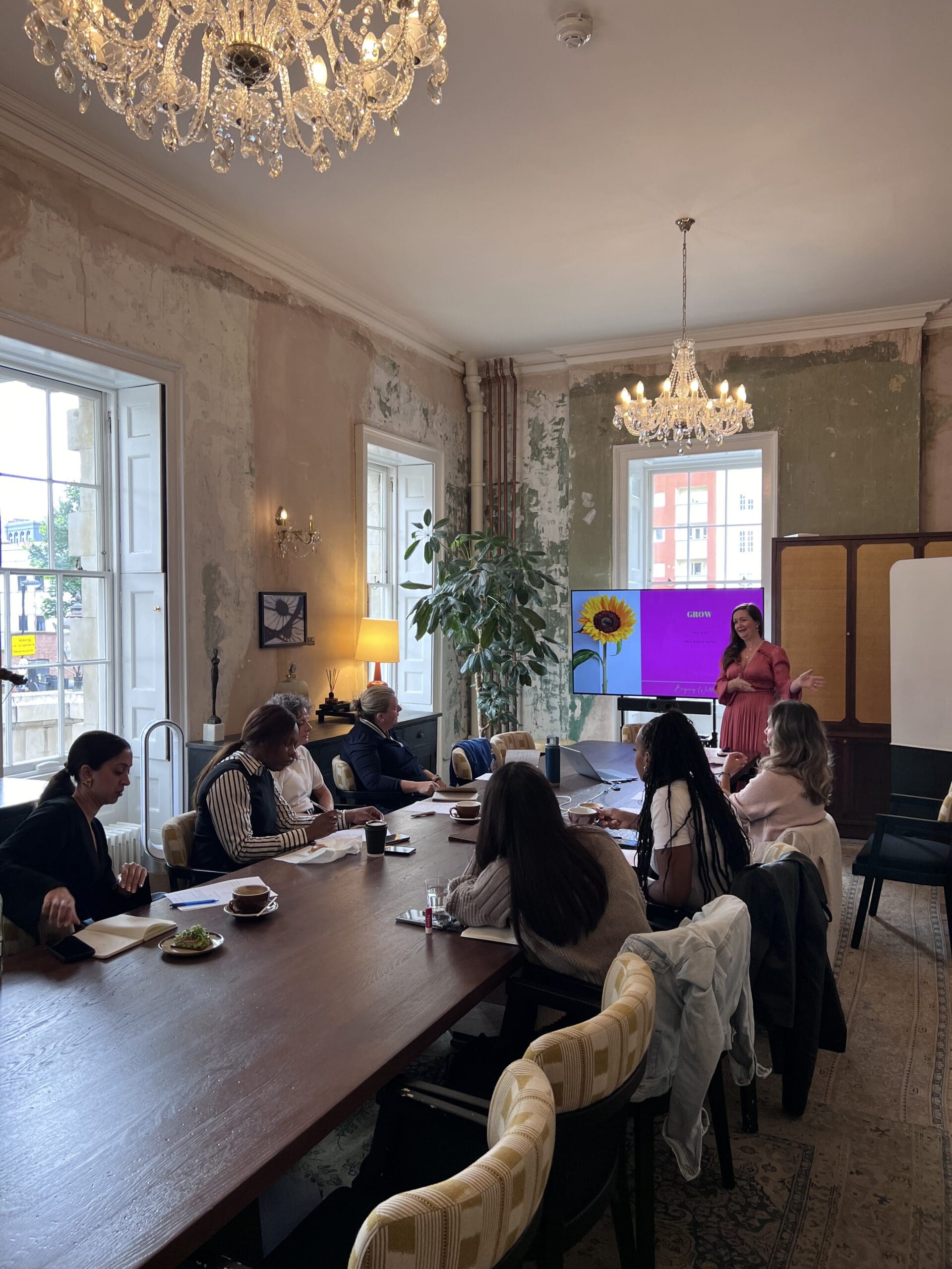 Professional woman reflecting during career accelerator programme, planning strategic career move with confidence